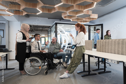 Young group of business people brainstorming together in a startup space, discussing business projects, investments, and solving challenges.