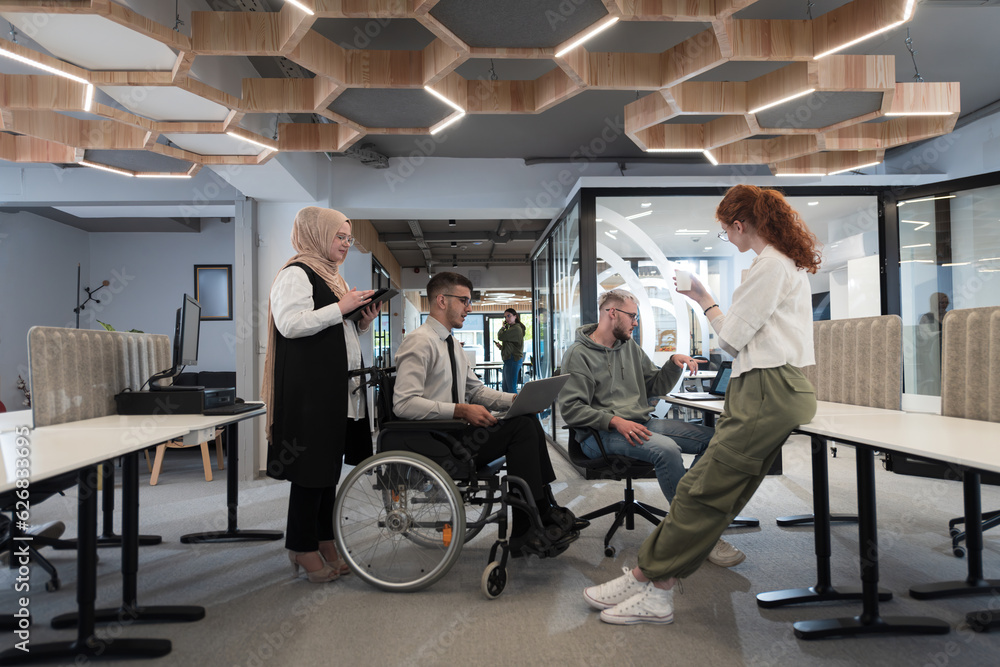 Young group of business people brainstorming together in a startup space, discussing business projects, investments, and solving challenges. Young group of business people brainstorming together in a startup space, discussing business projects, investments, and solving challenges.