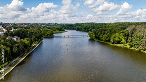 panoramic view of the white old stone manor on the shore of the lake and with the park in the city of Bogoroditsk