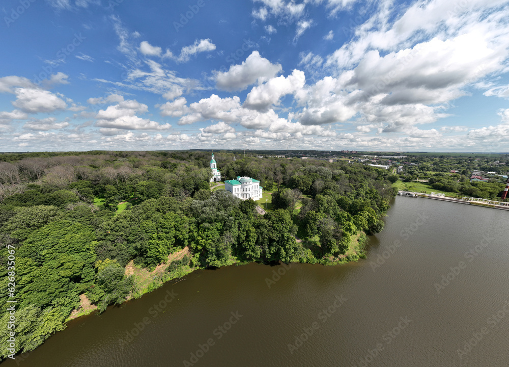 panoramic view of the white old stone manor on the shore of the lake and with the park in the city of Bogoroditsk panoramic view of the white old stone manor on the shore of the lake and with the park in the city of Bogoroditsk