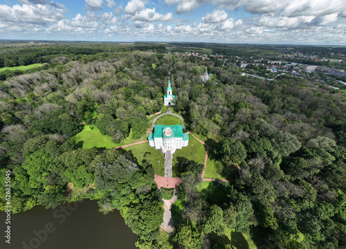 panoramic view of the white old stone manor on the shore of the lake and with the park in the city of Bogoroditsk photo