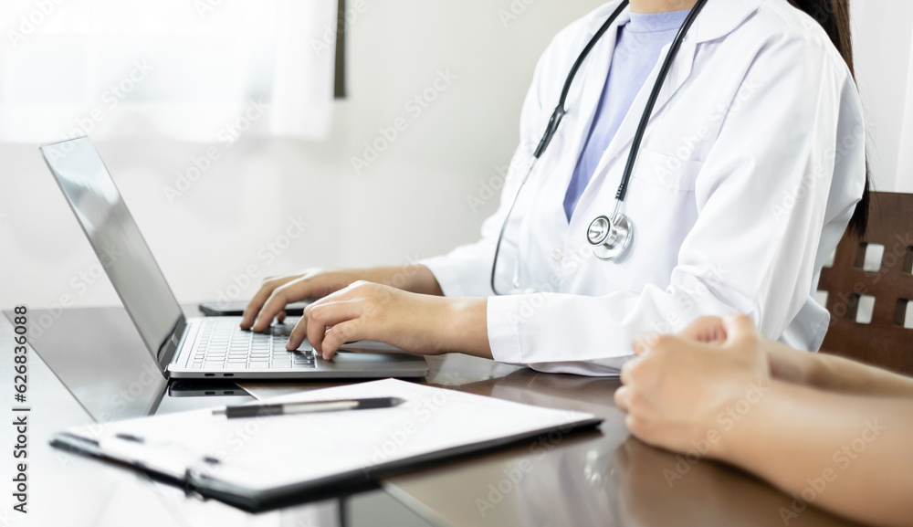 Female doctors who treat patients make an appointment to listen to the results after a physical examination and explain medical information and diagnose the disease. Medical concepts and good health