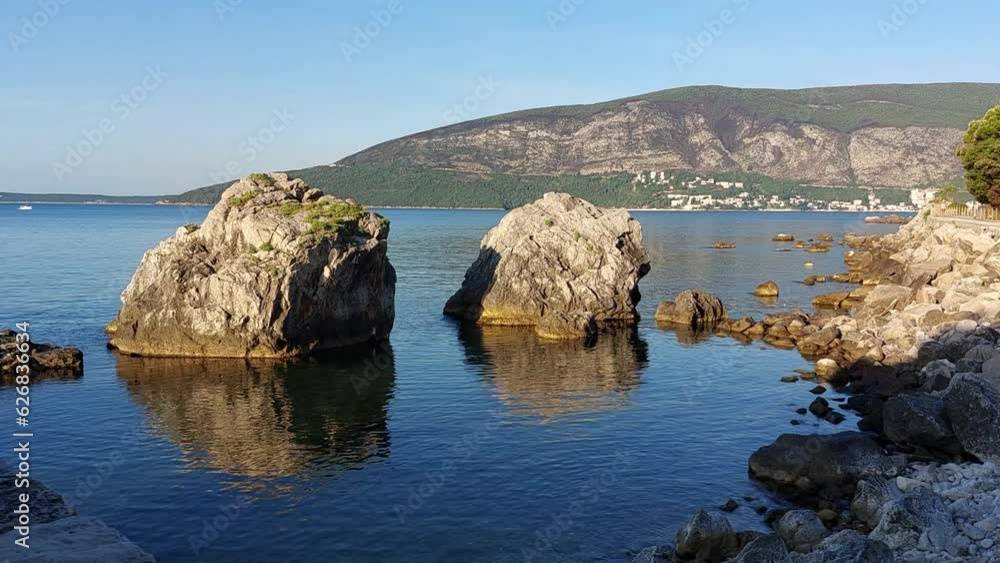 Seaside coast with big rocks. Sunny morning summer time video. Seaside coast with big rocks. Sunny morning summer time video.