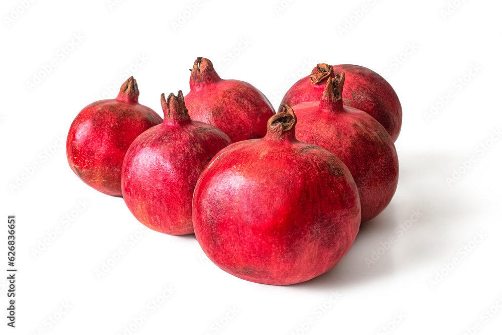 Red pomegranate fruits on a white background Red pomegranate fruits on a white background
