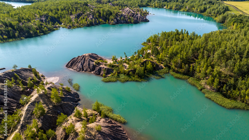 panoramic view of the high hills of the lake with turquoise water and green forest from the reserve in the Tula region taken from a drone panoramic view of the high hills of the lake with turquoise water and green forest from the reserve in the Tula region taken from a drone