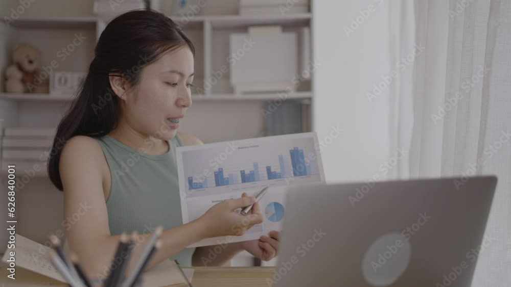 Female student watching teacher's live performance ,Video call on laptop in classroom at home, Conversations with teachers and classmates, Online learning, Study at your own home. Female student watching teacher's live performance ,Video call on laptop in classroom at home, Conversations with teachers and classmates, Online learning, Study at your own home.