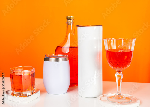 With a touch of sophistication, a mockup image presents a white blank tumbler arranged with a wine-themed flair
