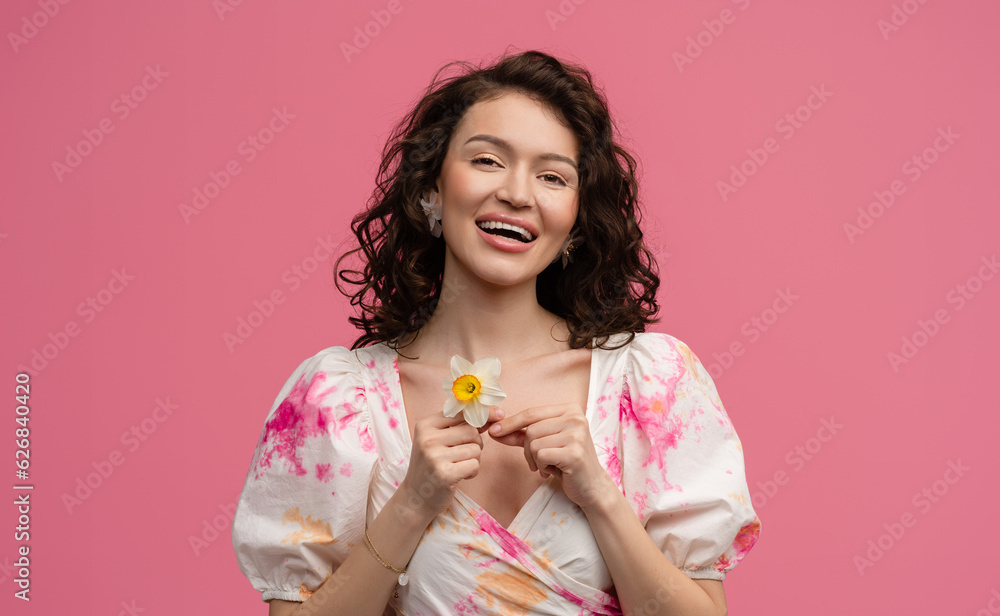 pretty young woman posing isolated on pink studio background in dress pretty young woman posing isolated on pink studio background in dress
