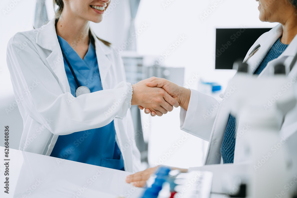 Doctor, handshake and partnership in healthcare, medicine or trust for collaboration, unity or support.Team of medical experts shaking hands in teamwork for or success in clinic or hospital Doctor, handshake and partnership in healthcare, medicine or trust for collaboration, unity or support.Team of medical experts shaking hands in teamwork for or success in clinic or hospital