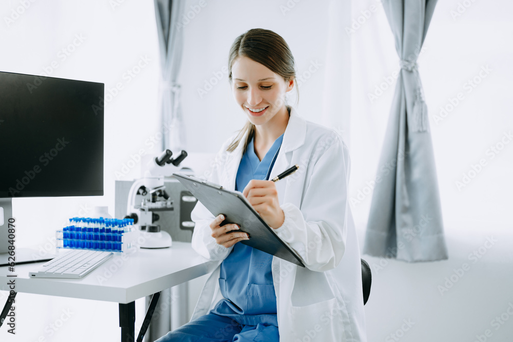 Caucasian smiling doctor or consultant sitting at a desk his neck biochemical samples, science chemical laboratory Caucasian smiling doctor or consultant sitting at a desk his neck biochemical samples, science chemical laboratory
