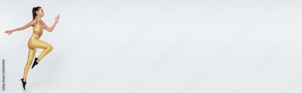 active lifestyle, aerobics, female athlete in active wear jumping on white background, banner active lifestyle, aerobics, female athlete in active wear jumping on white background, banner