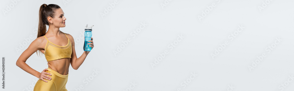 healthy habits, toned body, happy woman in active wear holding bottle with water on white, banner healthy habits, toned body, happy woman in active wear holding bottle with water on white, banner