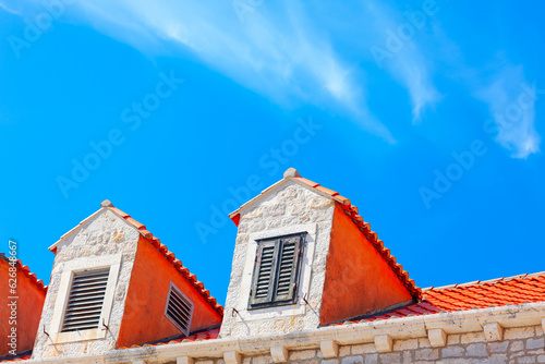Fototapeta Naklejka Na Ścianę i Meble -  Attics of old traditional house . Roofs of the old town of Dubrovnik, Croatia