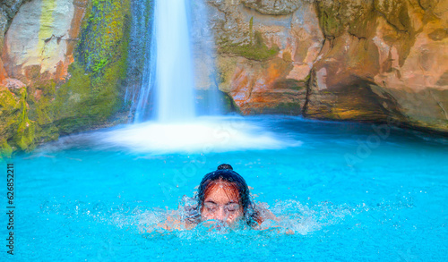 Beautiful girl is swimming underwater - Natural pools with blue water in a rocky Sapadere Canyon - Alanya, Turkey