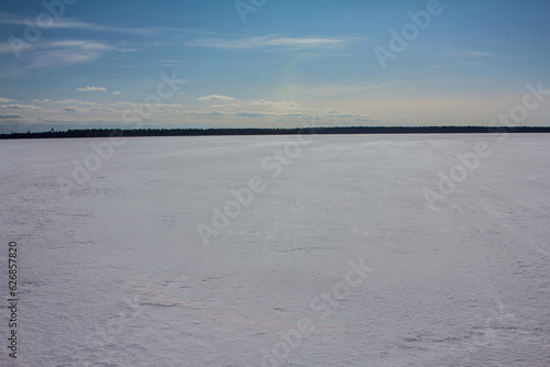Freezing sea. Smooth snowy ice surface after yesterday's snowfall, almost perfect surface photo