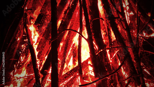 Huge fire at night timber crib fascinating and mesmerizing, primal power photo