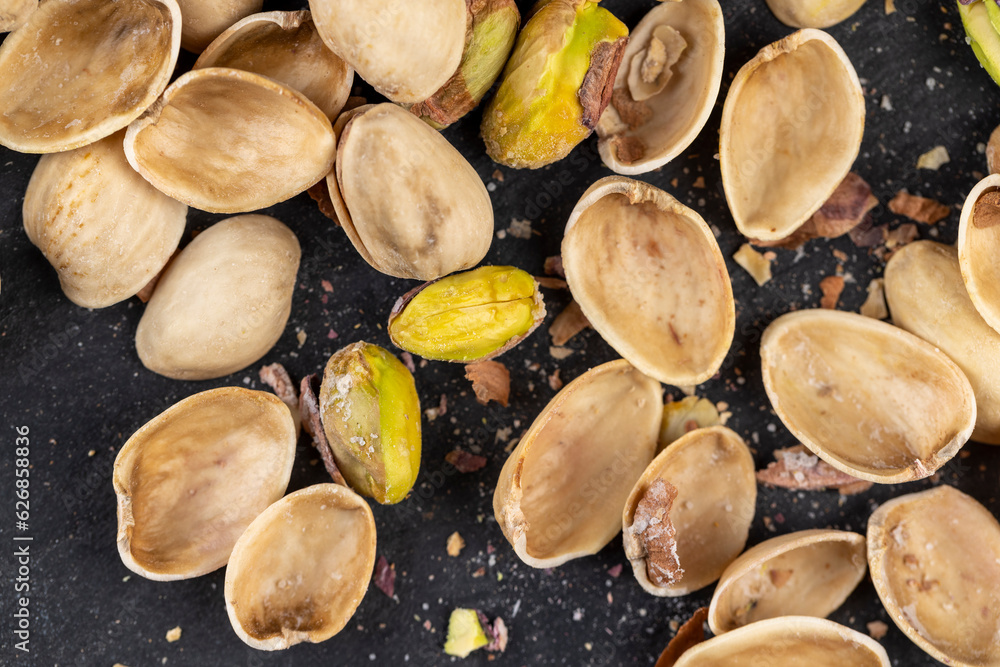 Fototapeta premium a large number of salty and crispy pistachios close-up