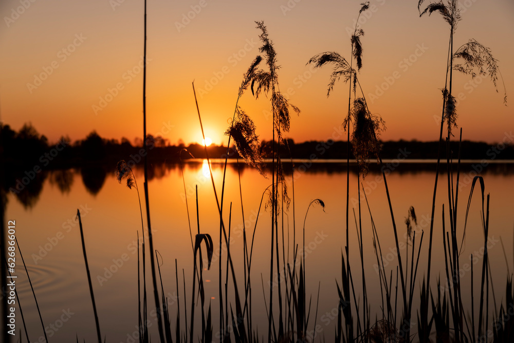 a beautiful reflection of the colorful sky in the water at sunset a beautiful reflection of the colorful sky in the water at sunset