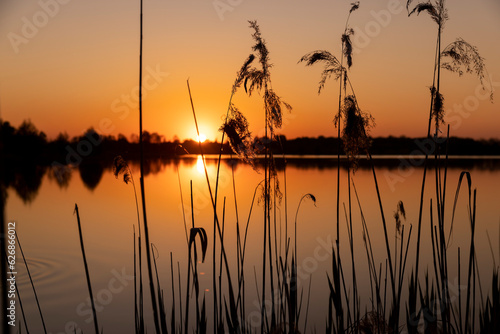 a beautiful reflection of the colorful sky in the water at sunset