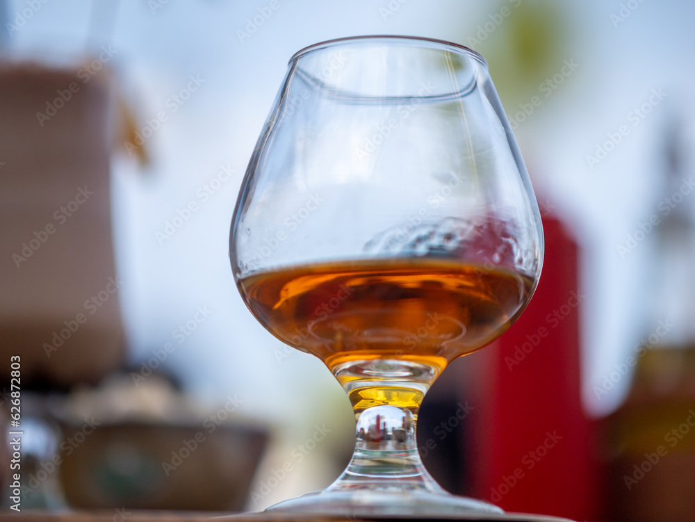 Whiskey glass on the background blurred Whiskey glass on the background blurred