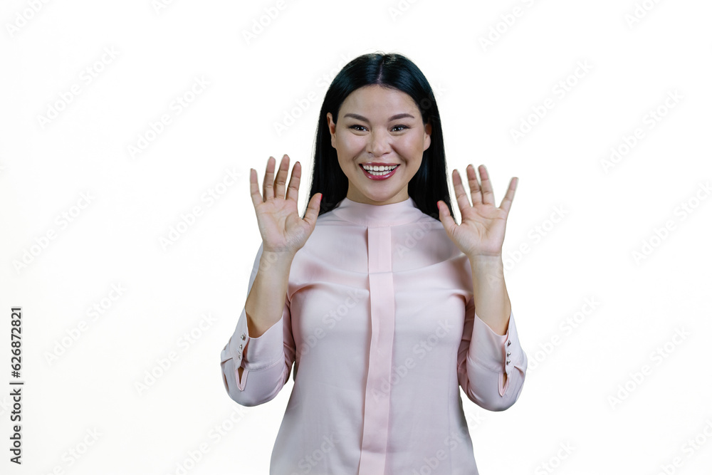 Portrait of smiling asian woman with her hands up. Isolated on white background. Portrait of smiling asian woman with her hands up. Isolated on white background.