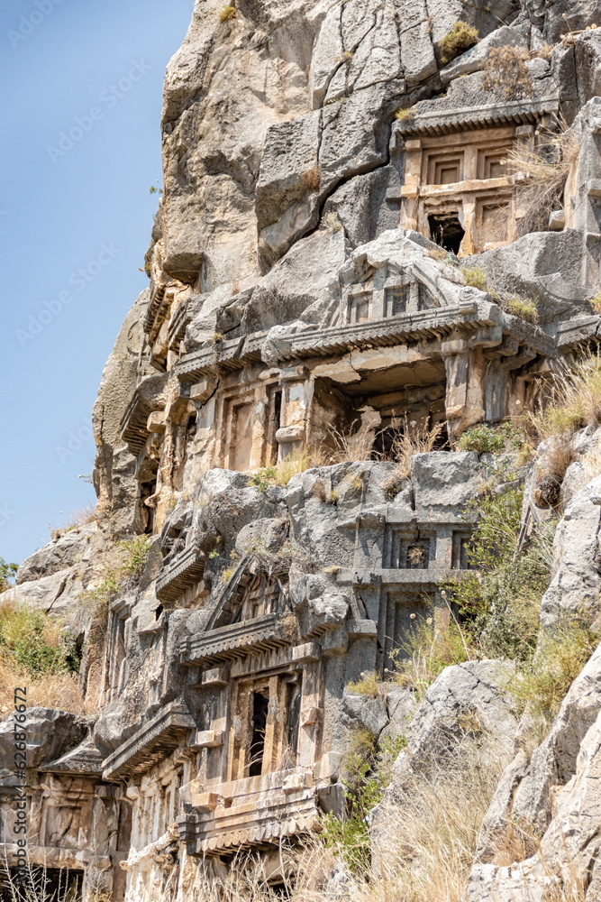 Lycian tombs in Myra. Ancient rock-cut necropilis. Open air museum in Demre (Turkey). Famouse tourist attraction, very pupular tour. Travel of history concept