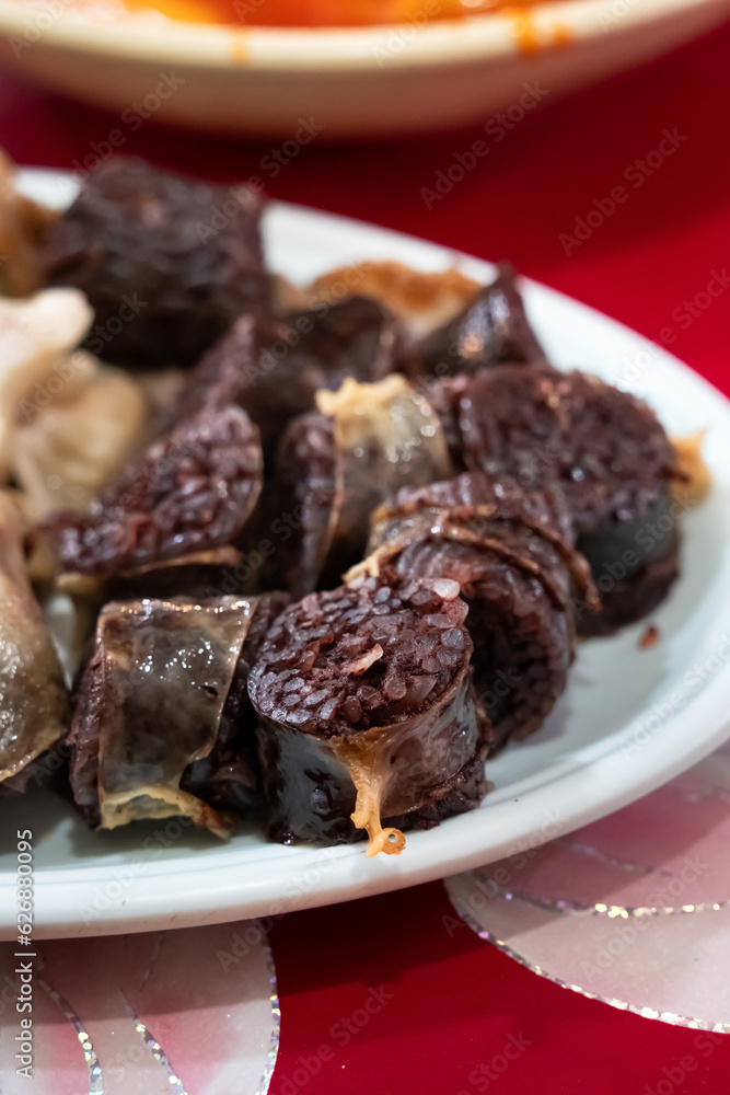 Delicious Korean cuisine Sundae and other pork edible viscera in market, street food. Delicious Korean cuisine Sundae and other pork edible viscera in market, street food.