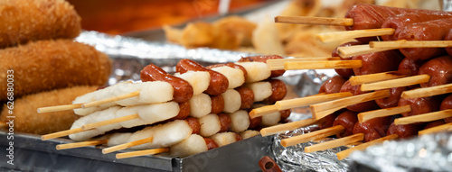 Delicious Korean cuisine Tteokbokki, spicy rice cake in market, street food. photo