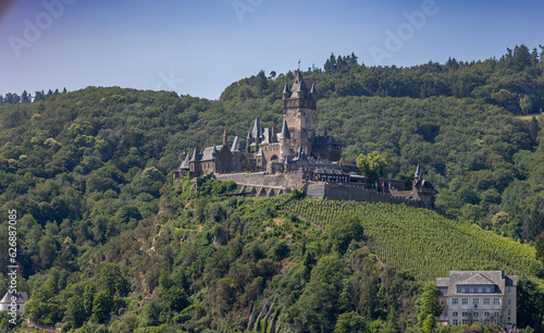 The old German medieval castle with the name Reichsburg Cochem in the hills near the town of Cochem on the river named Mosel  in the state of Rheinland-Pfalz
