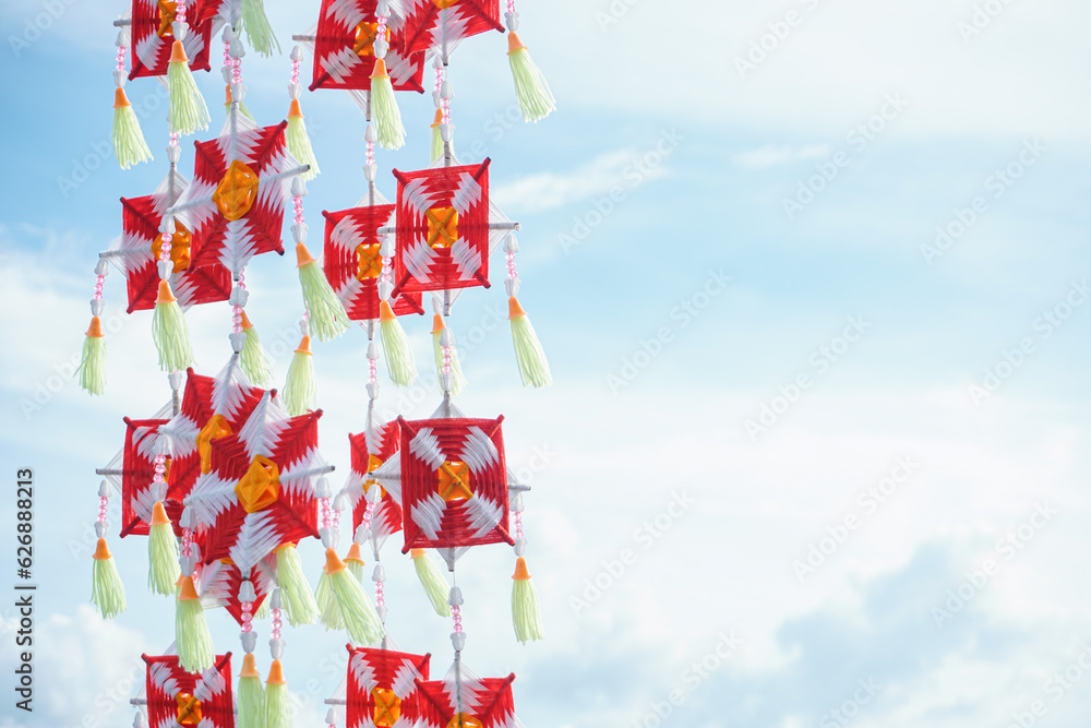 Naklejka premium Colorful hexagonal handwoven flags hang beautifully.