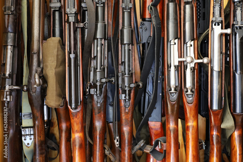 Fotografie, Obraz Automatic weapon collection, rifles and machine guns in gun cabinet