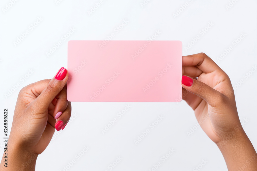 fashion red nail hand holding a blank pink card fashion red nail hand holding a blank pink card