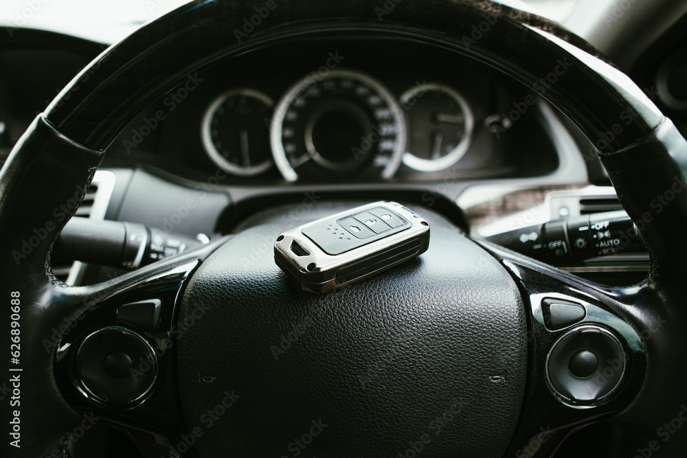 Car steering wheel with keyless remote in the car, Automotive concept. Car steering wheel with keyless remote in the car, Automotive concept.