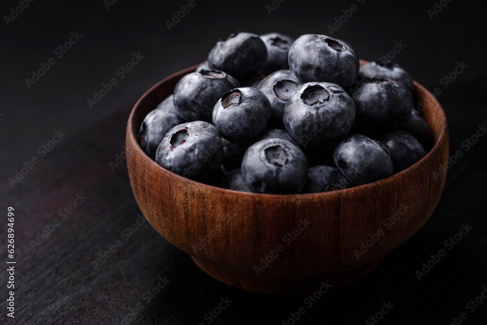 Delicious fresh sweet blueberries in a ceramic bowl. Vegan food