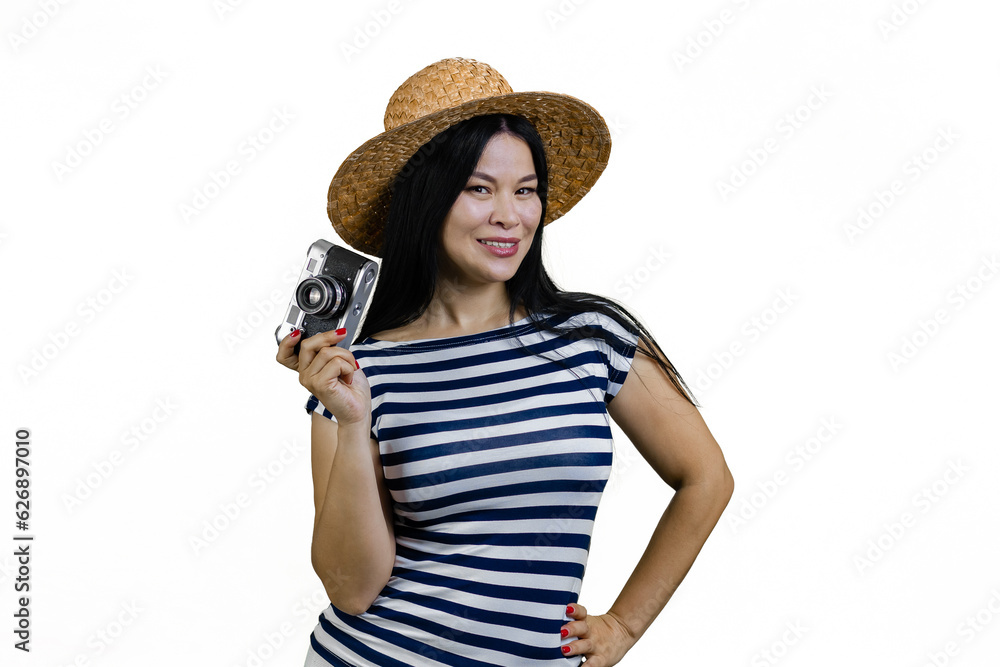 Young asian woman in straw hat is posing with a vintage photo camera. Isolated on white. Young asian woman in straw hat is posing with a vintage photo camera. Isolated on white.