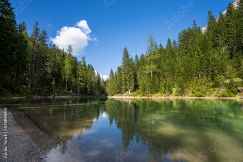 Fototapeta Naklejka Na Ścianę i Meble -  The lake is clear, sometimes green, sometimes blue, and surrounded by mountains. Nature's Wonderland: Lake Braies and its Captivating Alpine Scenery.