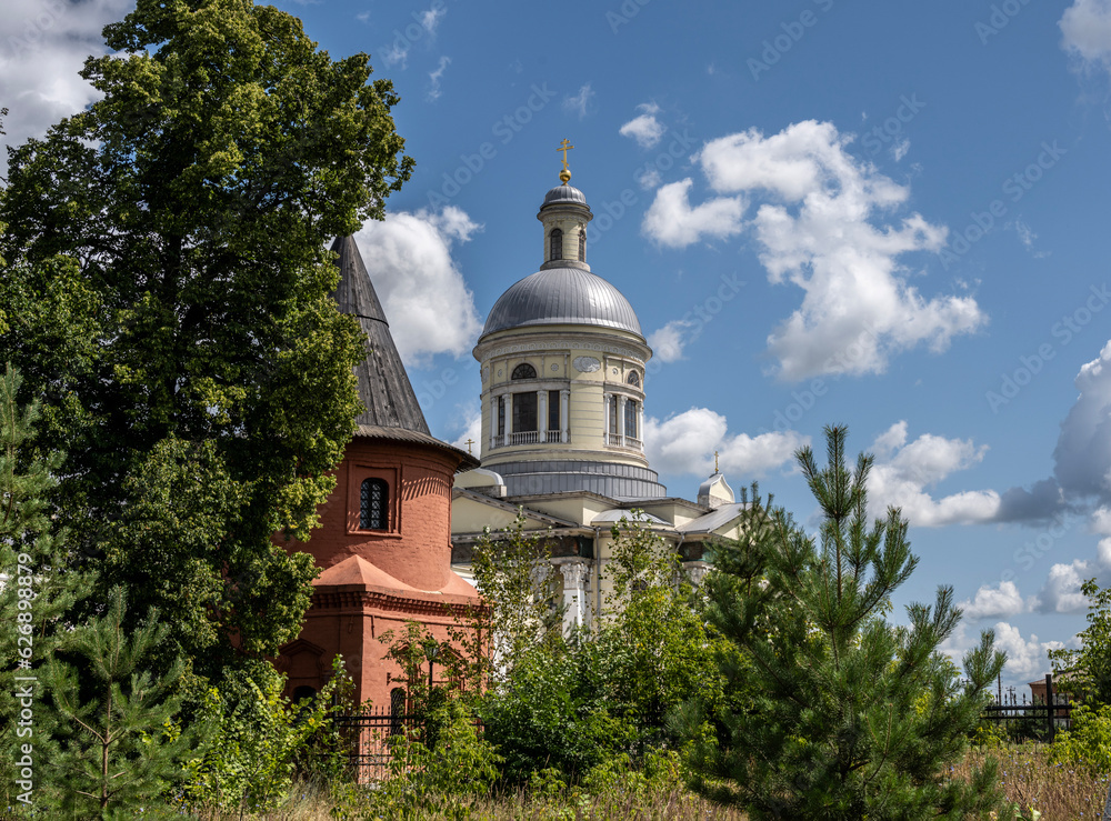 old stone church against the blue sky