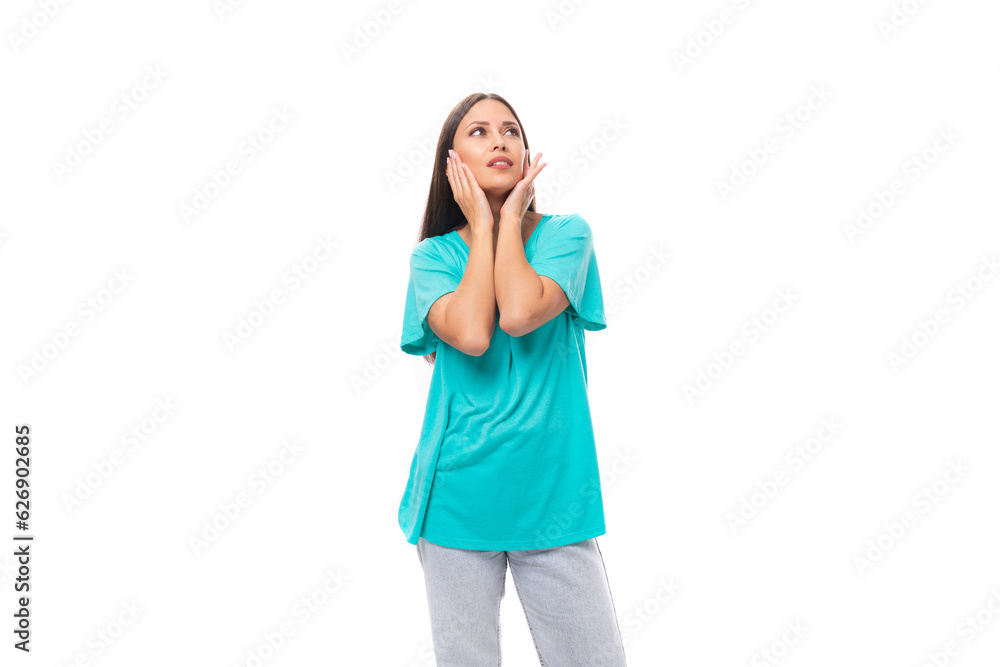 young pretty european woman with dark long hair dressed in blue casual clothes on a white background young pretty european woman with dark long hair dressed in blue casual clothes on a white background