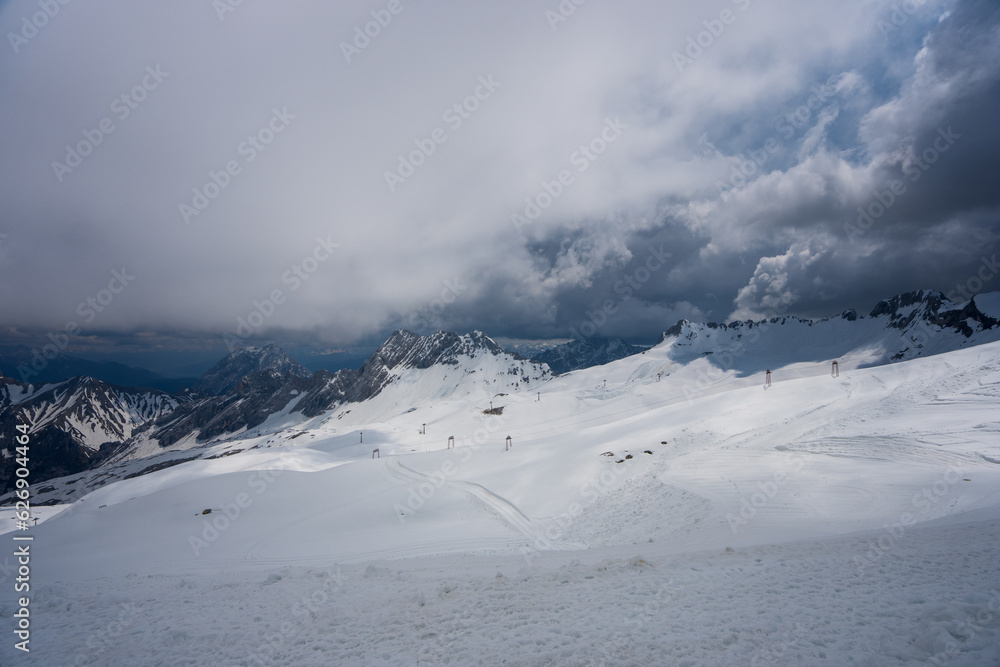 Overlooking the snow-covered ski facilities from the cable car. The Zugspitze belongs to the Alps and is the highest mountain in Germany. Overlooking the snow-covered ski facilities from the cable car. The Zugspitze belongs to the Alps and is the highest mountain in Germany.