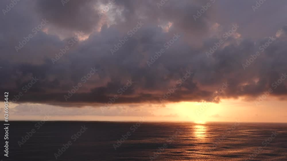 Nature. Sea sunset. Majestic sunset or sunrise landscape Amazing light of nature cloudscape sky and Clouds over sea moving away rolling 4k colorful dark sunset clouds. Beautiful sky. Nature. Sea sunset. Majestic sunset or sunrise landscape Amazing light of nature cloudscape sky and Clouds over sea moving away rolling 4k colorful dark sunset clouds. Beautiful sky.