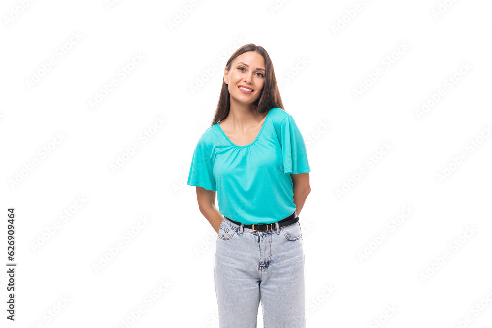 young well-groomed caucasian female model with black silky smooth hair is dressed in a blue t-shirt young well-groomed caucasian female model with black silky smooth hair is dressed in a blue t-shirt