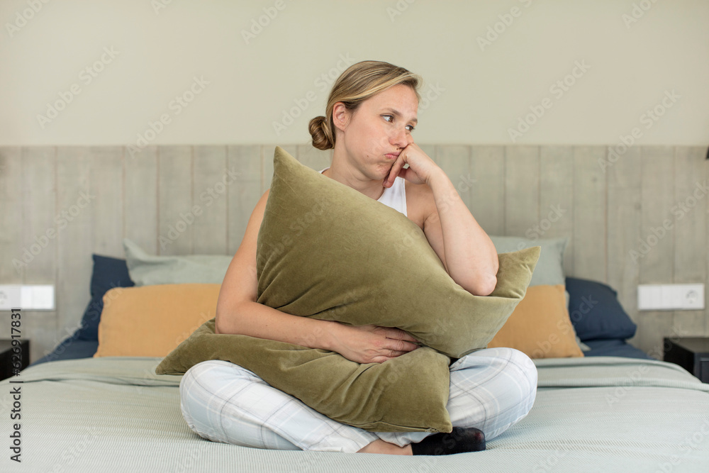 feeling bored, frustrated and sleepy after a tiresome. pajamas or night wear concept feeling bored, frustrated and sleepy after a tiresome. pajamas or night wear concept