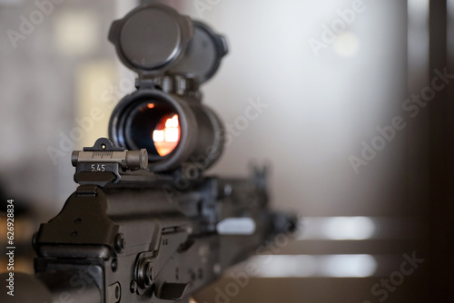 Assault rifle with collimator sight close up  selective focus. Modern weapon of military force