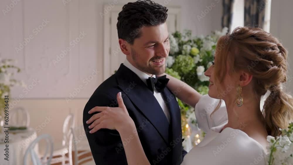 Bride and groom do first wedding dance in front of altar Bride and groom do first wedding dance in front of altar