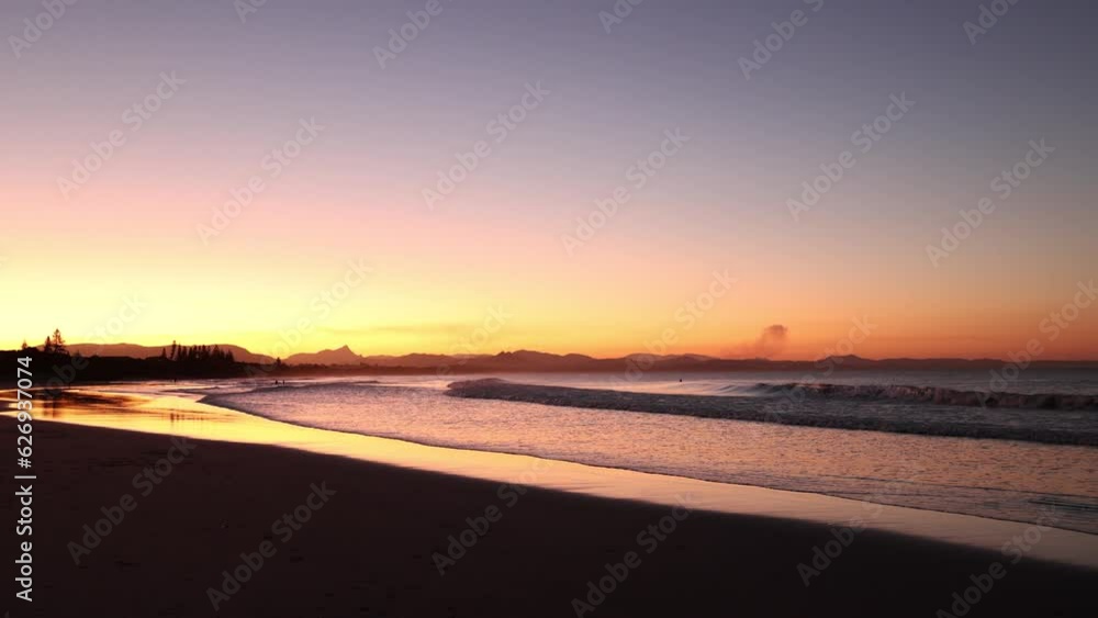 Sunset beach views across Main Beach in Byron Bay, New South Wales, Eastern Australia Sunset beach views across Main Beach in Byron Bay, New South Wales, Eastern Australia
