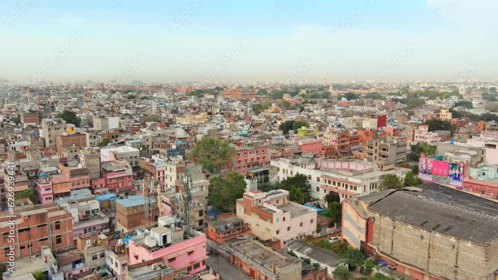 Jaipur, India: Aerial view of capital and largest city of Rajasthan, famous palace The Hawa Mahal, built from red and pink sandstone - landscape panorama of South Asia from above Jaipur, India: Aerial view of capital and largest city of Rajasthan, famous palace The Hawa Mahal, built from red and pink sandstone - landscape panorama of South Asia from above