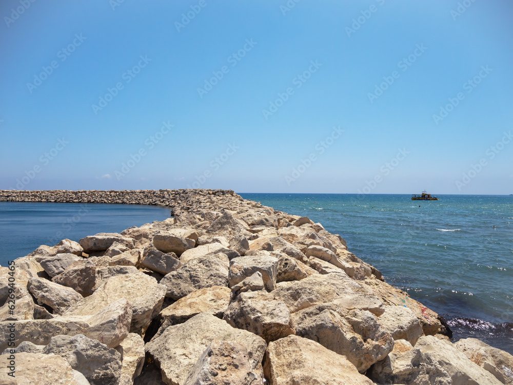 The rocky seashore, the waves crashing against the rocks. The rocky seashore, the waves crashing against the rocks.