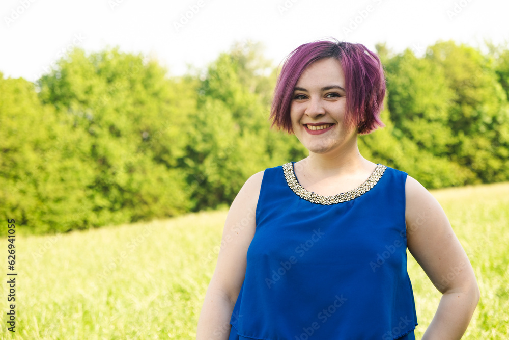 Young woman with purple hair, short haircut in nature Young woman with purple hair, short haircut in nature