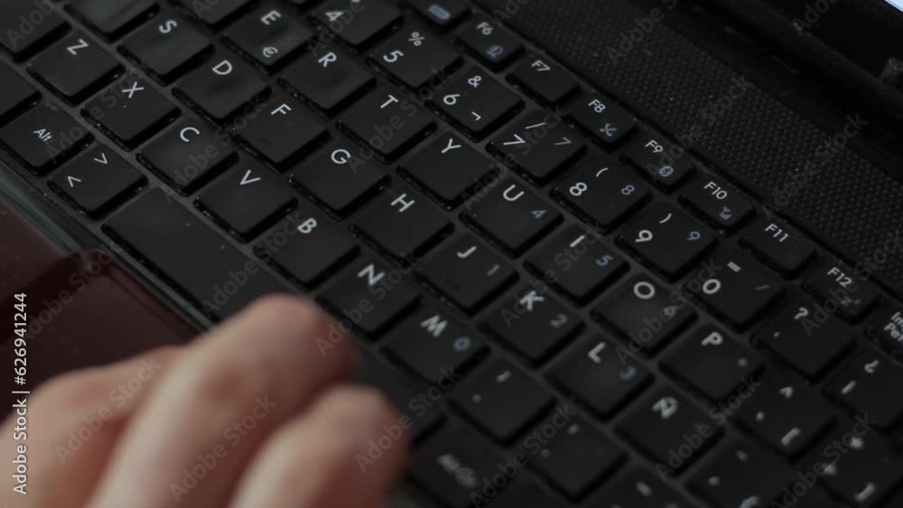 Hand of a Man on Laptop Computer Keyboard. Close Up. Hand of a Man on Laptop Computer Keyboard. Close Up.