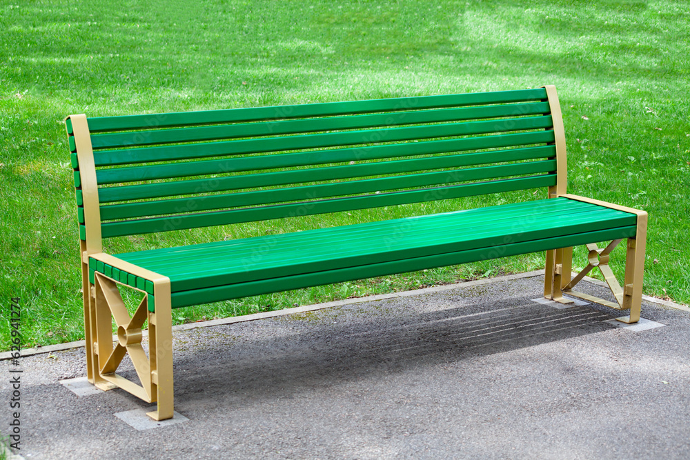Green Wooden bench in the city park Green Wooden bench in the city park